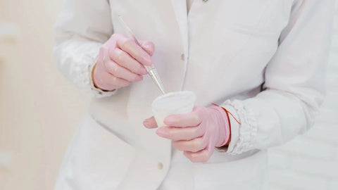 Dermatologist mixing an occlusive moisturizer