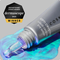 Cosmedix Opti Crystal Liquid Crystal Eye Serum in a light blue squeeze tube awards