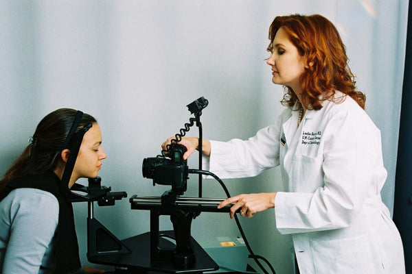 Dr. Baumann photographing a patient with a Canfield imaging camera in 2003