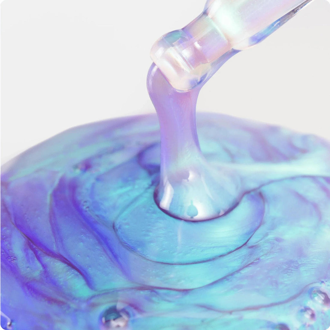 Cosmedix Opti Crystal Liquid Crystal Eye Serum in a light blue squeeze tube close up swatch