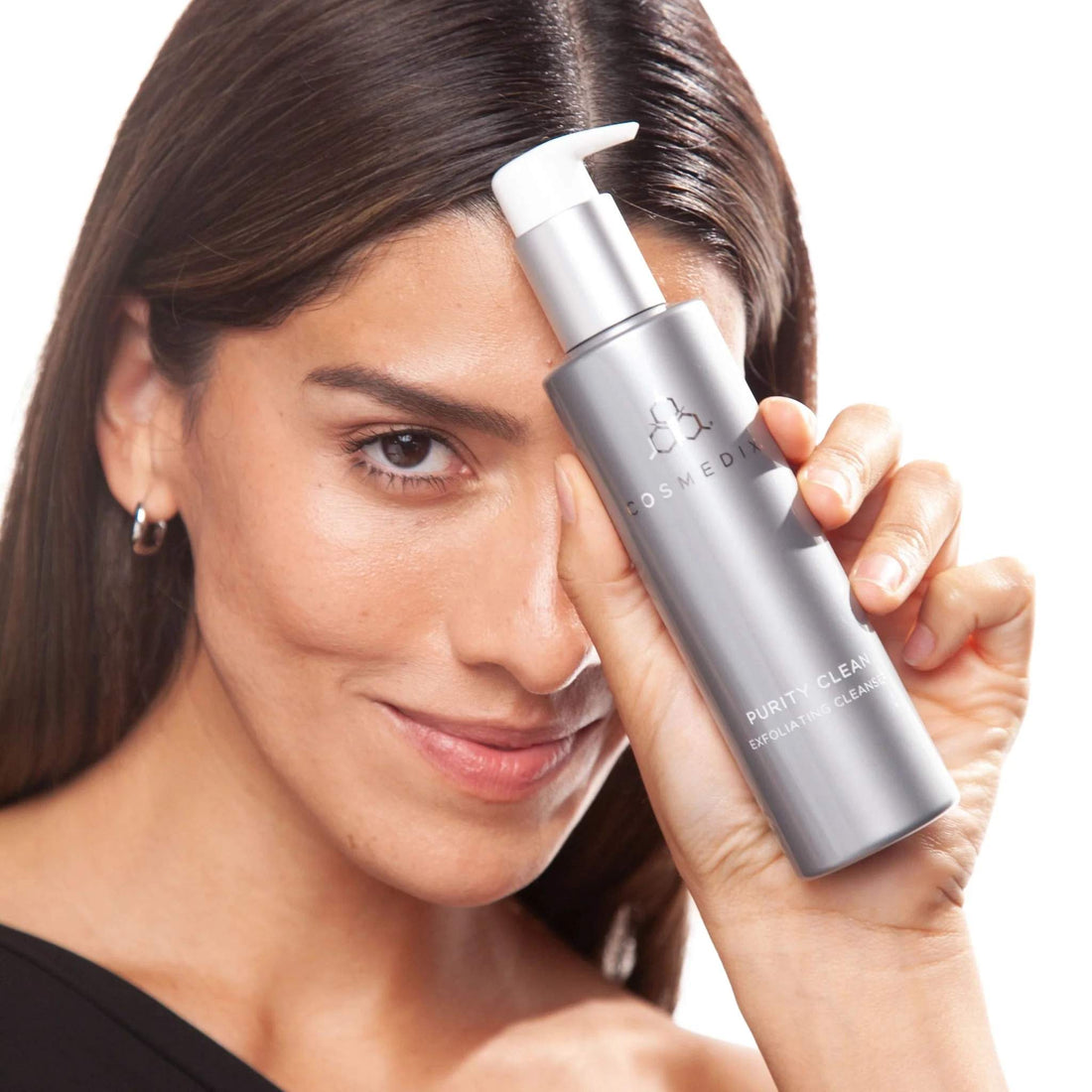 COSMEDIX Purity Clean Hydrating Cleanser in a sleek, metallic silver pump bottle with a white dispenser cap, shown against a plain white background. at skin type solutions with model