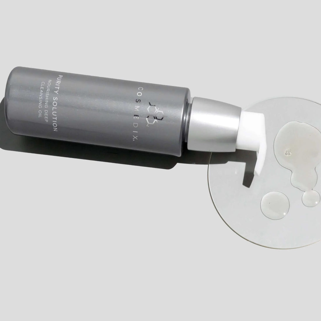 Cosmedix purity solution nourishing deep cleansing oil product with applicator on a light gray background at skin type solutions
