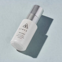 Cosmedix Revert Boosting Brightening Serum bottle on a blue background at skin type solutions
