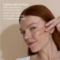 A white bottle of ISDIN Eryfotona Actinica Tinted Lightweight Emulsion Sunscreen SPF 50, skin type solutions model