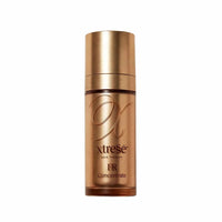 A bottle of xtreSe FR Concentrate hair therapy on a plain white background. at skin type solutions